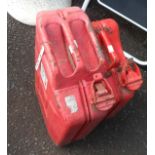 Two red painted metal jerry cans