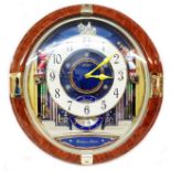 A Seiko 'Melodies in Motion' battery wall clock with moving action and flashing lights - Ref. QXM