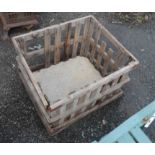 A rustic slatted wood log crate