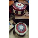 A pair of vintage pouffes with geometric coloured leatherette decoration