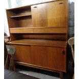 A 1.22m retro G-Plan style teak effect wall unit with fall-front writing compartment, flanking
