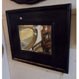 A wide stained wood framed bevelled oblong wall mirror - some veneer lifting