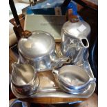 A vintage Picquot ware polished aluminium tea set comprising teapot, hot water jug, milk, sugar
