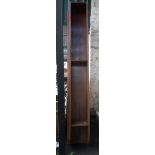 A large mahogany wall mounted book shelf