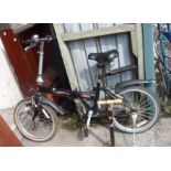 A Next 1 folding bike - sold with a hand pump