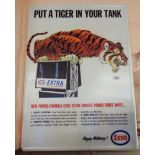 A modern printed tin Esso tiger advertising sign