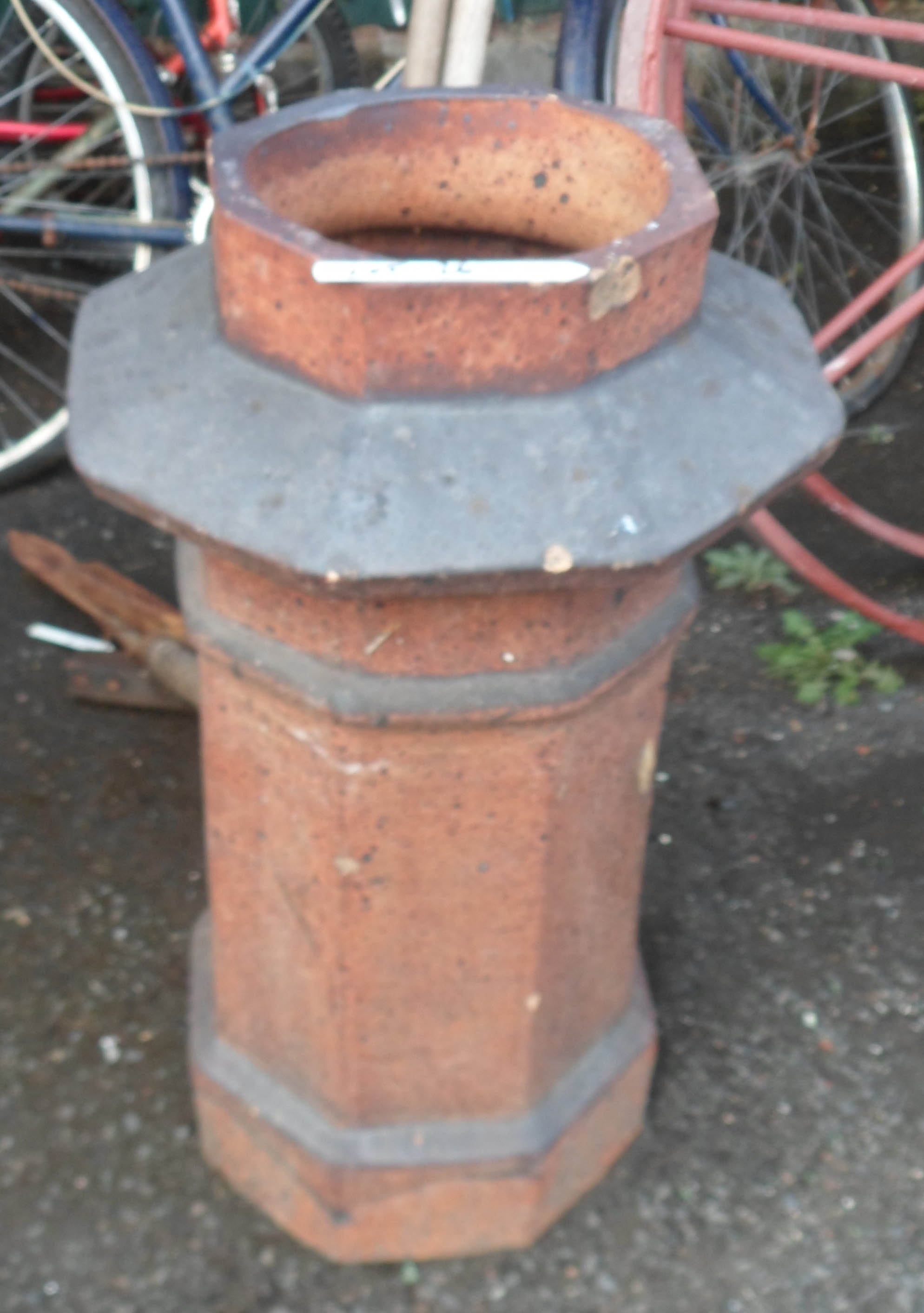 An old salt glazed stoneware chimney pot of octagonal form