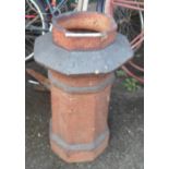An old salt glazed stoneware chimney pot of octagonal form