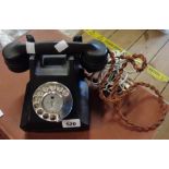 A vintage black Bakelite telephone - rewired for use