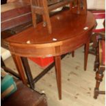 A 97cm reproduction mahogany cross banded and strung demi-lune fold-over tea table, set on square