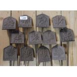 A set of twelve modern painted cast iron herb labels