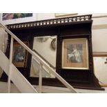 A 1.48m Edwardian stained oak framed overmantel mirror with spindle gallery, flanking shelves with