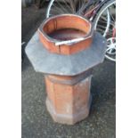 An old salt glazed stoneware chimney pot of octagonal form