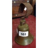 An old cast brass servants bell with remains of old wrought iron hanger