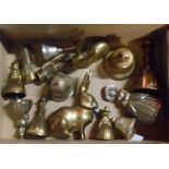 A box containing a quantity of assorted brassware including crinoline and Welsh lady bells, Queen