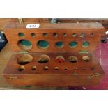 An antique wooden weight box with fitted interior for assorted brass weights - sold with a small