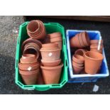 Two small crates containing a large quantity of terracotta garden pots