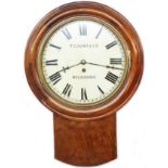 An early 20th Century stained wood cased drop dial wall timepiece, the 28.5cm dial marked for T.