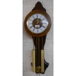 A modern Dutch stained wood cased wall clock with visible pendulum and twin weight driven ting-