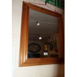 A modern pine framed oblong wall mirror