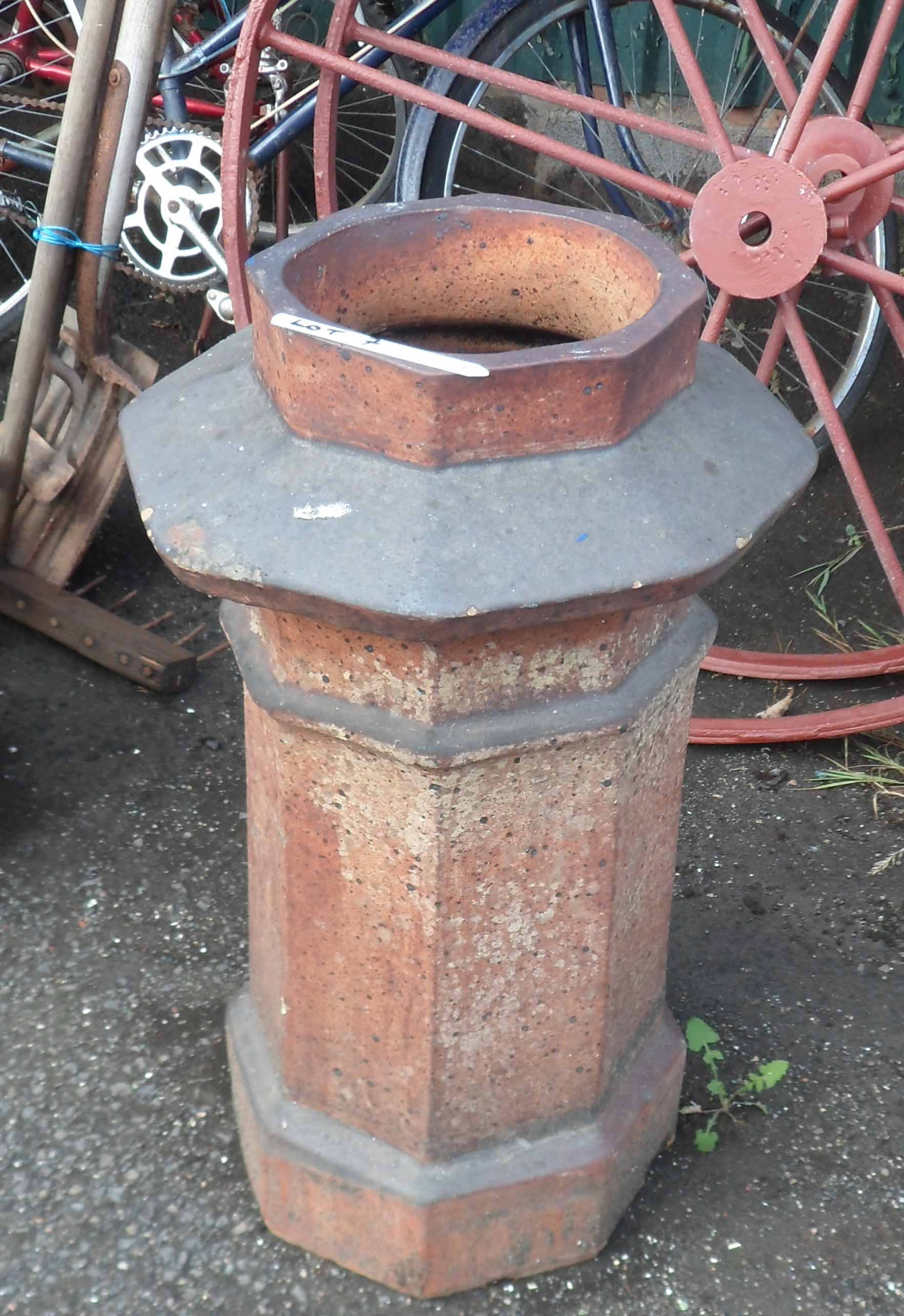 An old salt glaze stoneware chimney pot of octagonal form