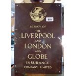 An old enamel sign with cream lettering on a brown ground 'Agency of The Liverpool and London and