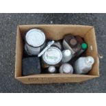 A box containing assorted joinery waxes and oils