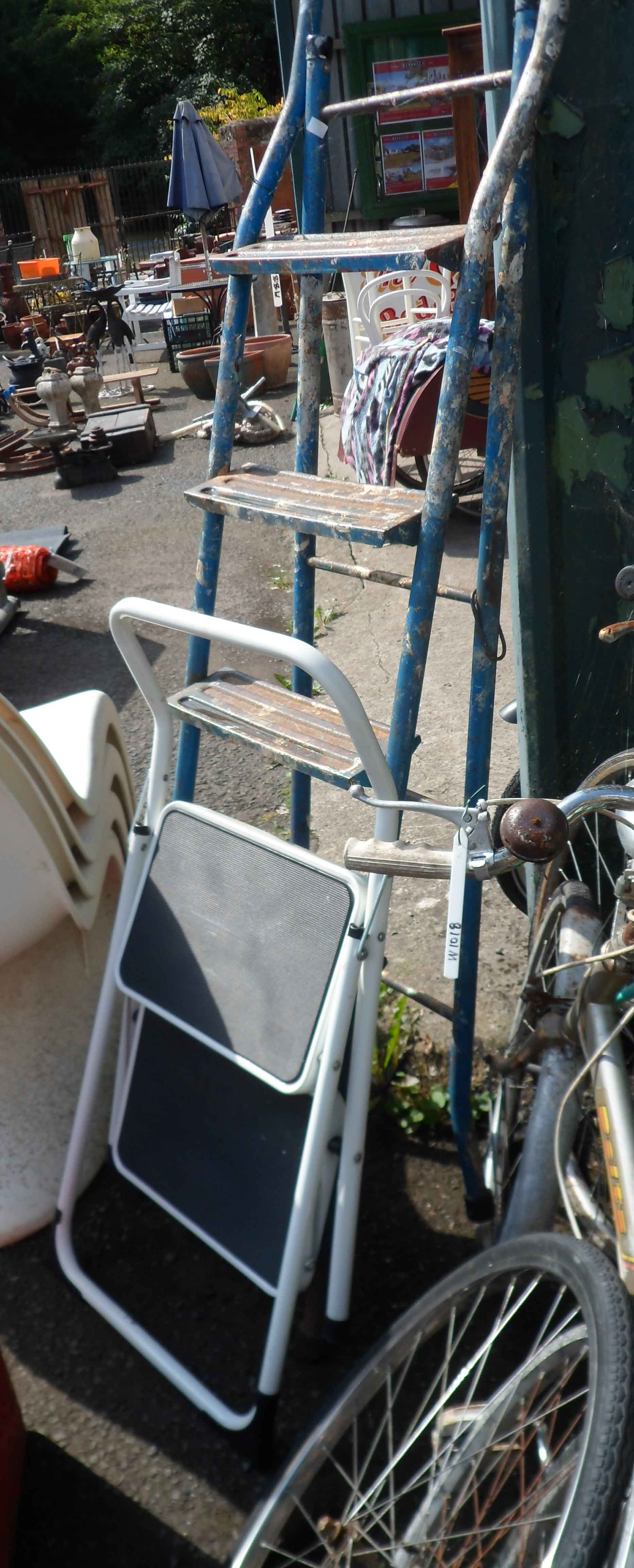 An old metal stepladder with blue painted finish - sold with a small two step similar