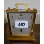 A vintage Angelus gilt metal cased alarm clock with date aperture and eight day fifteen jewel