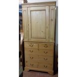An 87cm pine two part unit comprising a cupboard top, set on an antique chest of two short and three