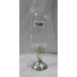 A 23.5cm high engraved glass candle holder with stylised berry decoration, set on a marked '
