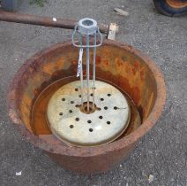 An old cast iron washing boiler and contents
