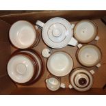 Two boxes containing a quantity of Denby stoneware tea and dinner ware in the Potters Wheel pattern