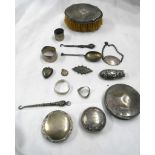 A small quantity of silver and white metal items including button hooks, heart form locket, silver