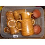 A box containing a quantity of Langley Stoneware teaware including teapot, cups and saucers, etc.