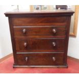 A 38cm antique mahogany chest with hinged lift-top over three graduated drawers, each with inset