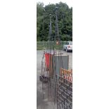 Two garden obelisks of wrought iron construction - sold with a smaller similar