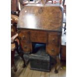 A 59cm 1920's walnut kneehole bureau with stationery rack fitted interior, frieze drawer and two