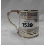 A silver tankard pattern christening mug with banded decoration and engraved name and date