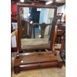 A Victorian mahogany platform dressing table mirror with oblong plate, set on a break front base