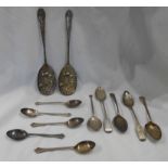 A bag containing ten assorted antique and later silver tea and coffee spoons, also a pair of