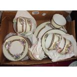 A Japanese Kokura porcelain part tea set comprising six trios, sugar bowl, bread and butter plate