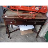 A 20th Century writing desk with two drawers and a central slide - top a/f and in need of