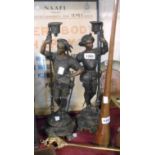 A pair of 19th Century French spelter figural candlesticks each depicting a soldier, set on plinth