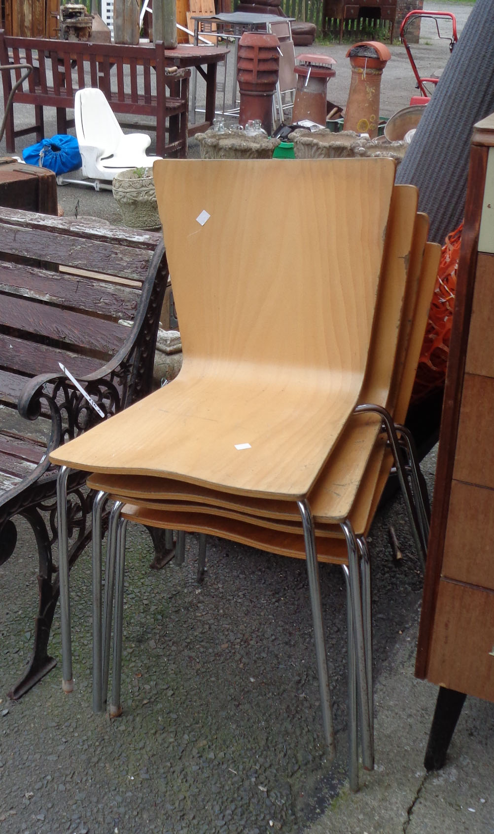 A set of four modern bentwood stacking chairs