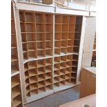 A modern mixed wood freestanding shop pigeon-hole storage/display unit comprising four sections,