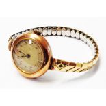 A vintage 375 (9ct.) gold cased lady's wristwatch with overwound Swiss movement on later expanding