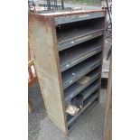 An old metal workshop pigeon-hole racking unit with grey painted finish