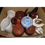 A box containing a quantity of ceramic items including teapots, biscuit barrels, etc.