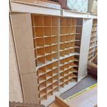 A modern mixed wood freestanding shop pigeon-hole storage/display unit comprising four sections,